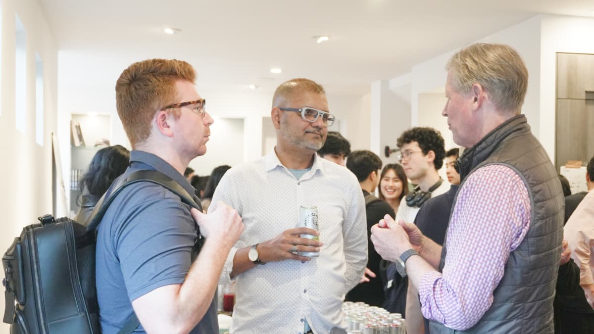 Attendees network at the launch party. Photo by EO.