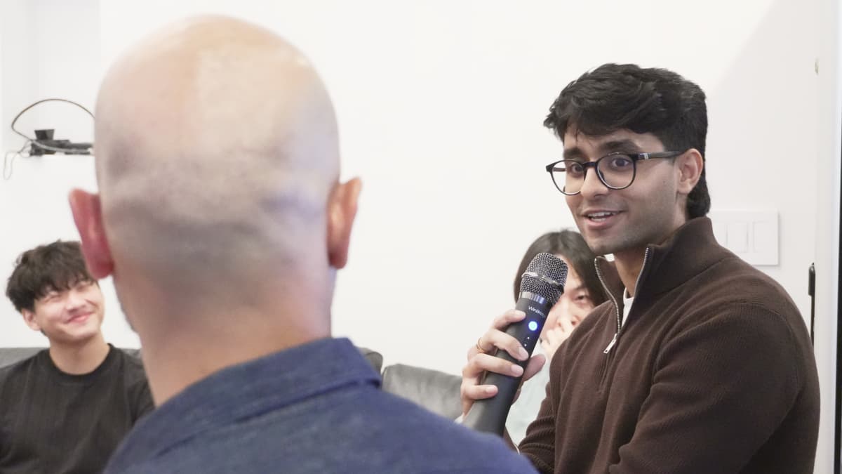 Gupta asks D'Souza a question during the panel. Photo by EO.
